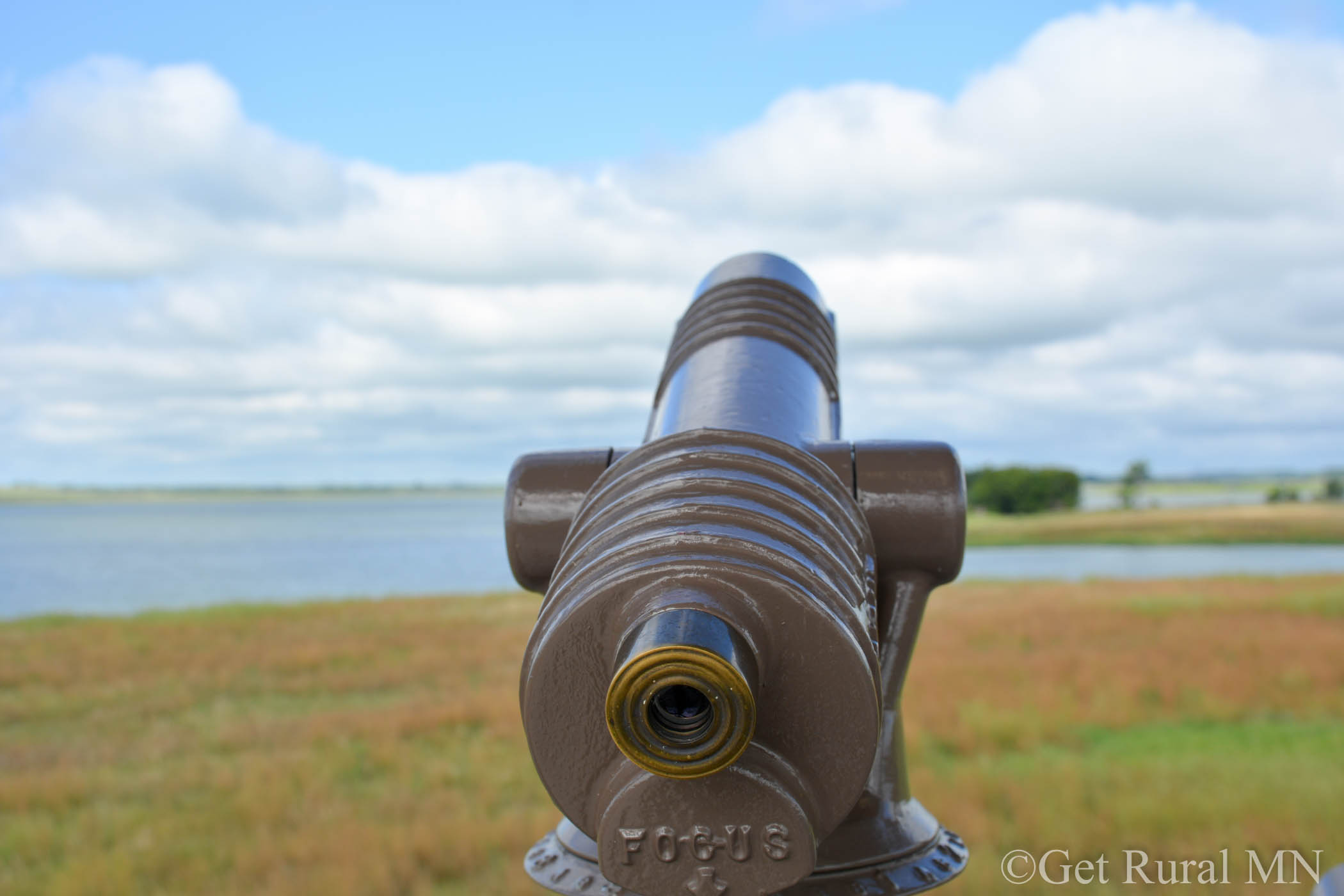 Close up of telescope pointed towards the sky